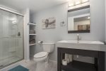 Soak In the Steam and Relax After a Fun-filled Day by the Shoreline in the Lower Level Bathroom